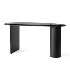 a black table with an oval top and curved legs on the bottom, against a white background