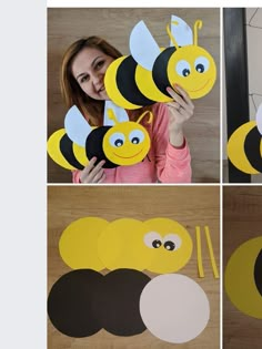 a woman holding up some paper cut out of bees