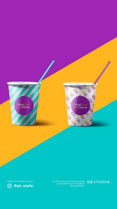 two ice cream cups with straws in them on a multicolored background, one is purple and the other is blue