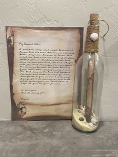 a message in a bottle next to an old paper