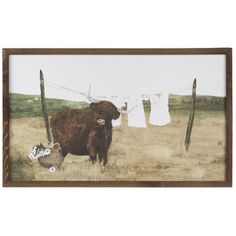 a cow standing next to clothes hanging on a line in a field with an animal nearby