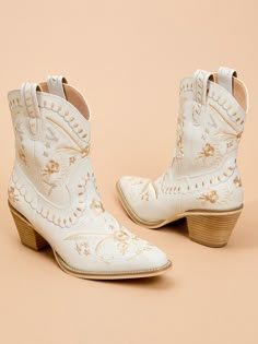 Make a statement with your shoe game in the most stunning pair of embroidered booties. With a wide sole and slip-on feature, these shoes are perfect for comfort and style. White Dress Boots, Last Hoedown, Celebration Of Marriage, Autumn Celebration, Cozy Winter Boots, Last Rodeo, Skirt And Top Dress, Bridal Shoe, Summer Beach Wedding