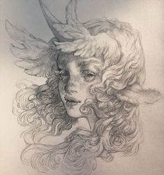 a pencil drawing of a woman's face with horns and wings on her head