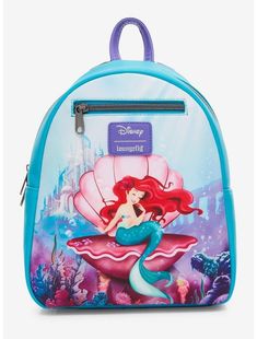 Loungefly Disney The Little Mermaid Ariel Shell Mini Backpack Pack all of your thingamabobs for your trip under the sea with this The Little Mermaid mini backpack! Featuring a drawing of Ariel sitting in a clam shell, with the kingdom of Atlantica in the background. Comes with adjustable straps, interior drop pocket, front zipper pocket and top carrying handle. Please note: Cardholder sold separately. 8'' x 4 1/2'' x 10 1/2'' Polyurethane Adjustable straps Interior drop pocket Imported By Lounge Ariel Drawing, The Little Mermaid Ariel, Disney The Little Mermaid, Little Mermaid Ariel, Loungefly Bag, Disney Ariel, Loungefly Disney, Backpack Brands, Disney Lilo