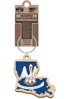 a wooden key chain with a blue and white bird on it