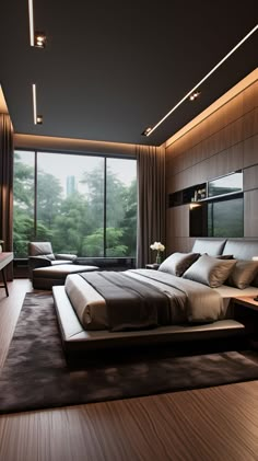 a large bed sitting in the middle of a bedroom next to a tall glass window