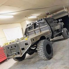 an off road vehicle is parked in a garage