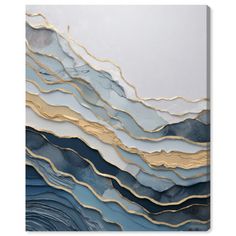 an abstract painting with gold, blue and white waves on the wall in front of it