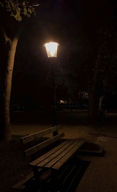 a park bench under a street light at night