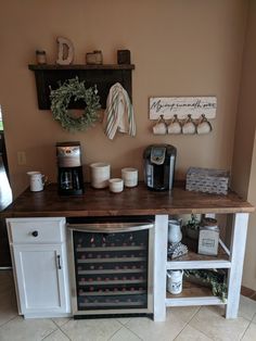 a kitchen with a wine cooler and coffee maker