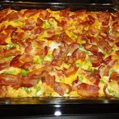 a casserole dish with bacon, cheese and lettuce