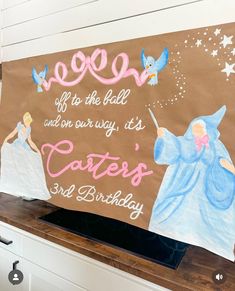 a birthday sign is displayed on the counter