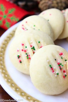 some cookies with sprinkles on a plate