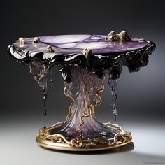 an elaborately designed table with purple and gold decorations on it's pedestals