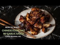 chinese eggplant w / garlic sauce on a plate with chopsticks next to it