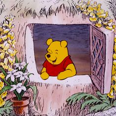 winnie the pooh looking out from an open window with flowers in front of it