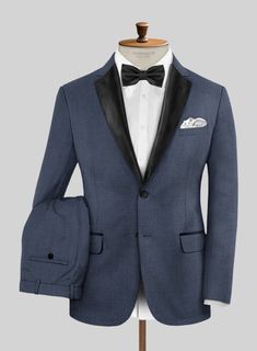 Stand out in style in this striking and dapper wool tuxedo suit in blue tailored for a sharp silhouette making it a versatile addition to your all occasion wardrobe. Crafted from wool blend, the tuxedo suit helps create a stunningly stylish look and is versatile enough to keep you in vogue.  Featuring satin lapel, matching satin covered buttons and gentle texture at its surface, our tuxedo is a subtle fashion-forward take on a traditional tailoring.  Look Includes   Napolean Slate Blue Wool Fabr