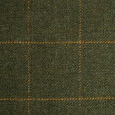 a close up view of a green and brown checkered wool suiting material,