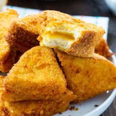 some fried food is stacked on top of each other and ready to be eaten by someone