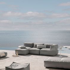 an outdoor seating area overlooking the ocean