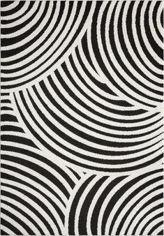 a black and white rug with wavy lines