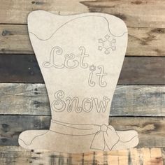 a wooden sign that says let it snow on the side of a wood plank wall