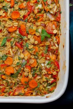 a casserole dish filled with carrots and other vegetables