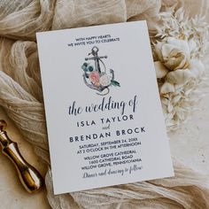 a wedding card with an anchor and flowers on it