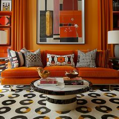 an orange living room with black and white decor