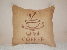 a pillow that has coffee on it with the words, but first coffee written on it