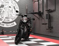 a motorcycle is parked in a garage with checkered flooring and red brick walls