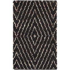 a black and white rug with an intricate design on the bottom, in front of a white background