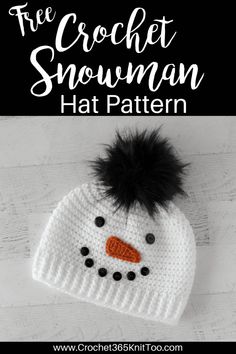 a crochet snowman hat with black pom - pom on top