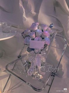 a basket filled with lots of cupcakes on top of a table