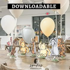 winnie the pooh balloon centerpieces on a table