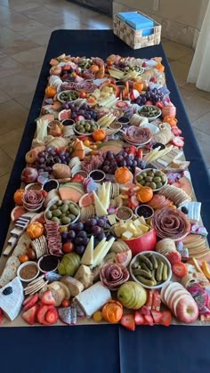 a long table covered in lots of different types of food