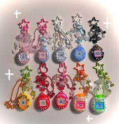 a bunch of key chains that are all different colors and shapes with numbers on them