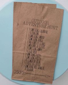 two brown paper bags sitting on top of a blue plate