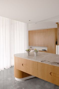 a kitchen counter with two bowls on it