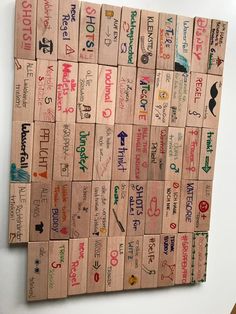 several pieces of wood that have different types of words on them, all written in different languages