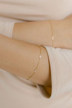 Both elegant and timeless, this bracelet features six bezeled diamonds on a delicate cable chain. Length: 7" Material & Care 14k Yellow Gold Hypoallergenic Can be worn in water For more info: Jewelry Care How to Wear Wear alone or stacked with your favorite bracelets. Bracelet Ideas Gold Women, Bracelet Designs Gold For Women, Bracelets Gold Simple For Women, Minimal Gold Bracelet, Simple Gold Bracelet, Maharashtrian Jewellery, Diamond By The Yard, Delicate Gold Bracelet, Silver Bracelet Designs