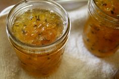 two jars filled with food sitting on top of a towel