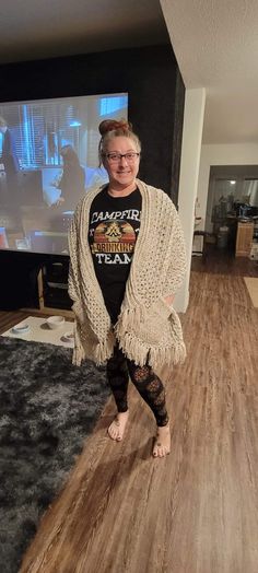 This crochet shawl with pockets and frings is handmade by me. It is made with acrylic yarn that is a beautiful aran fleck. This will be a awesome accessory/statement piece for this winter. This item comes in a one size fits all. Please excuse me being used as the model but I am 5'6 and this is where it hits lengthwise on me. It measures approximately 20 inches wide by 70 inches long. Please reach out to me if you have any questions about this garment. Beige Fringed Shawl For Winter, Bohemian Cream Shawl With Fringe, Beige Fringed Winter Shawl, Brown Bohemian Crochet Shawl, Boho Style Bag, Bohemian Scarves With Fringe, One Size, Ear Warmer Headband, Knit Dishcloth, Crochet Wrap