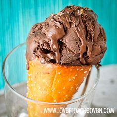 an ice cream sundae with chocolate frosting and sprinkles on top