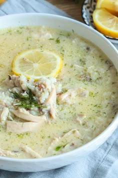 a white bowl filled with chicken and lemon soup