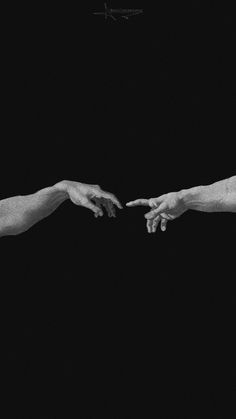 two hands reaching out towards each other