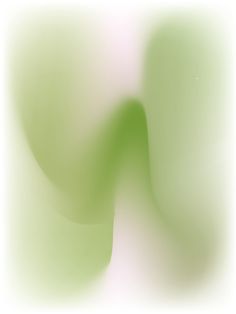 a blurry image of green and white colors