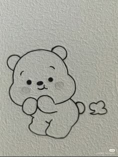 a drawing of a teddy bear holding a heart