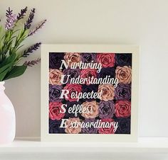 there is a vase with flowers on the shelf next to a framed print that says nursing