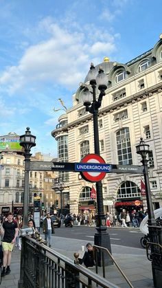 people are walking on the street in london